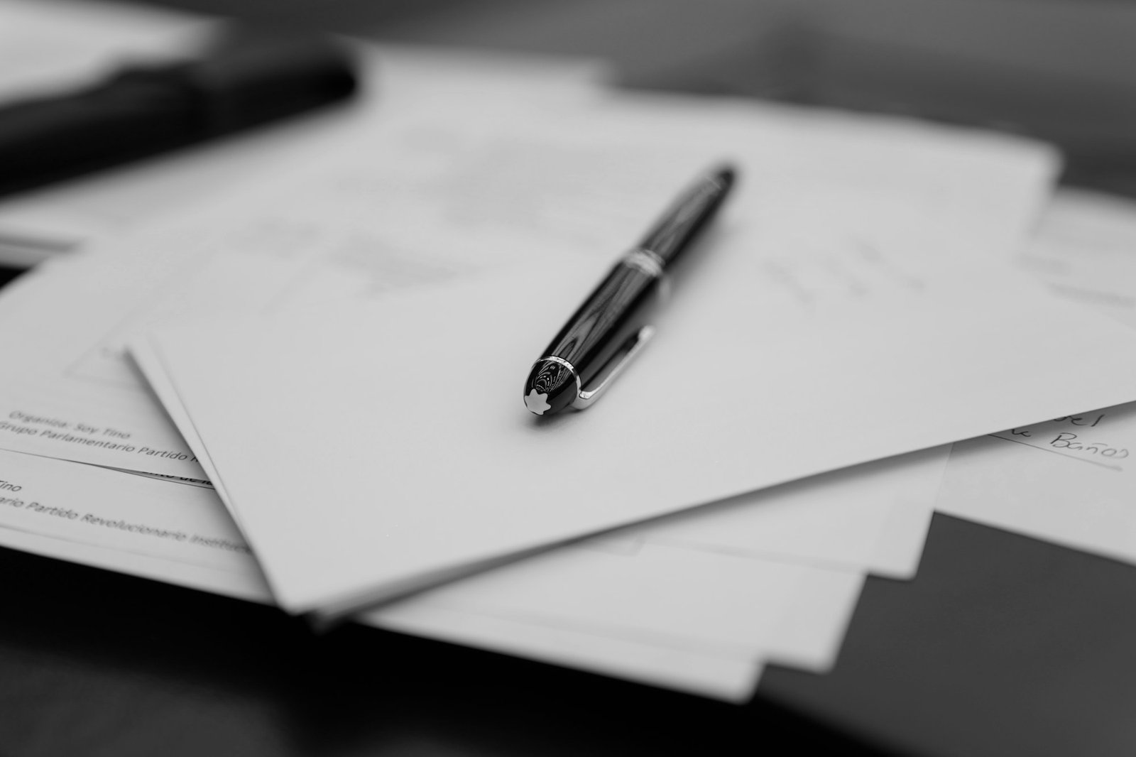 Papers and pens laid out across a desk