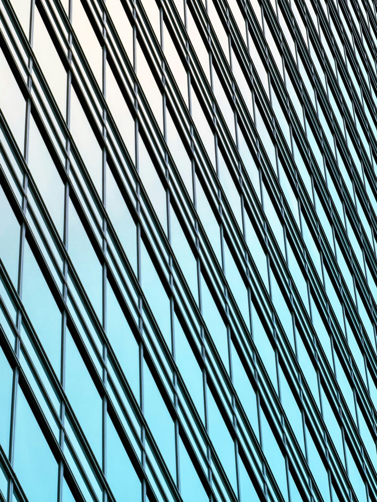 Reflective glass panels across a modern office facade