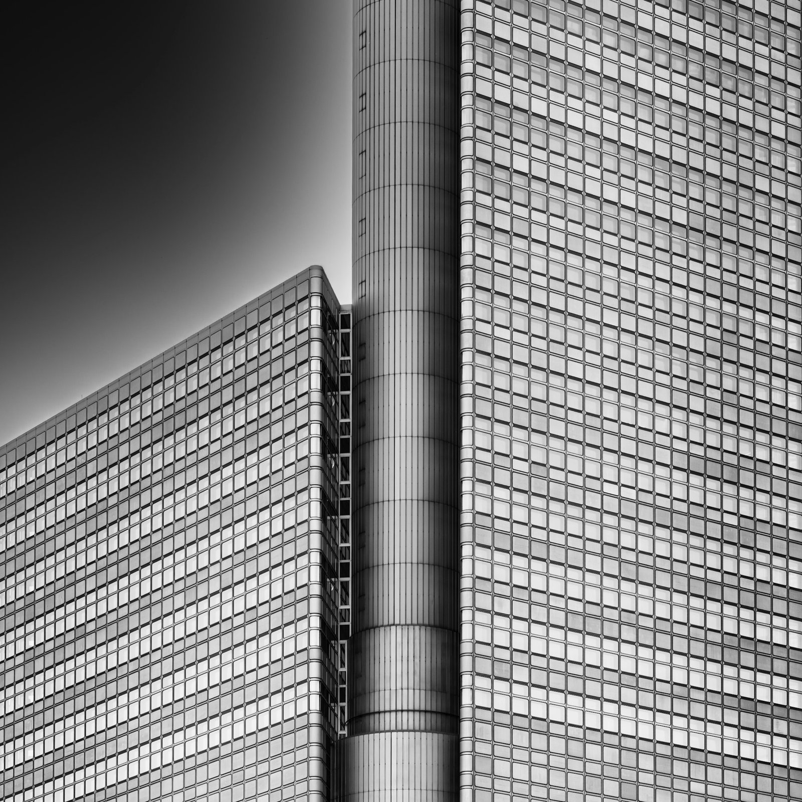 A modern office building facade of repeating windows